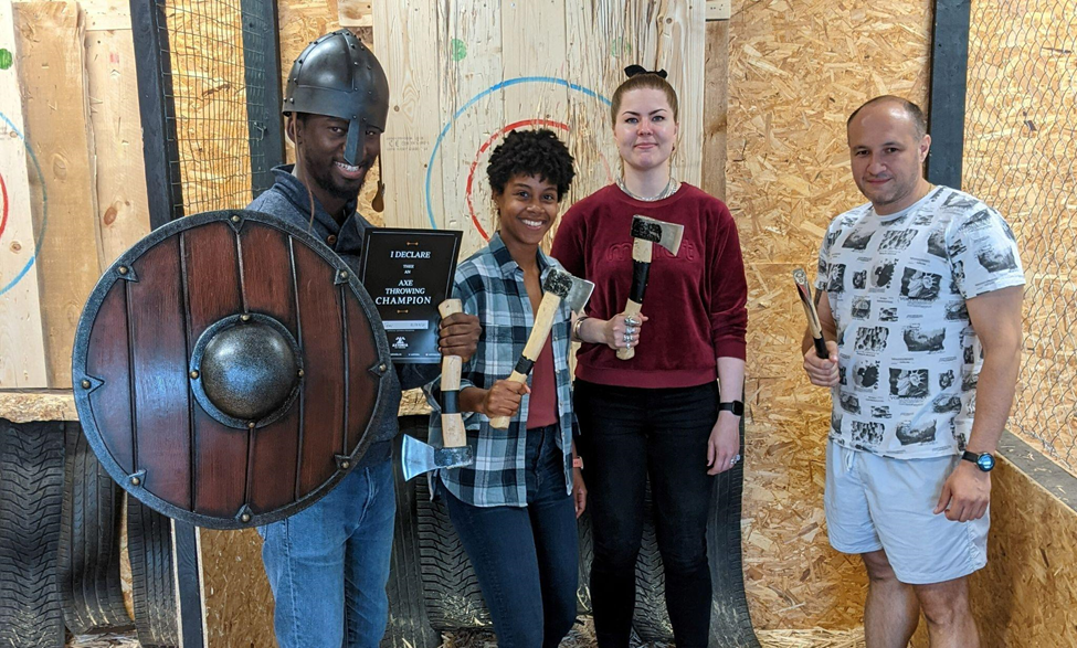 The Investor Relations team at an axe throwing event.