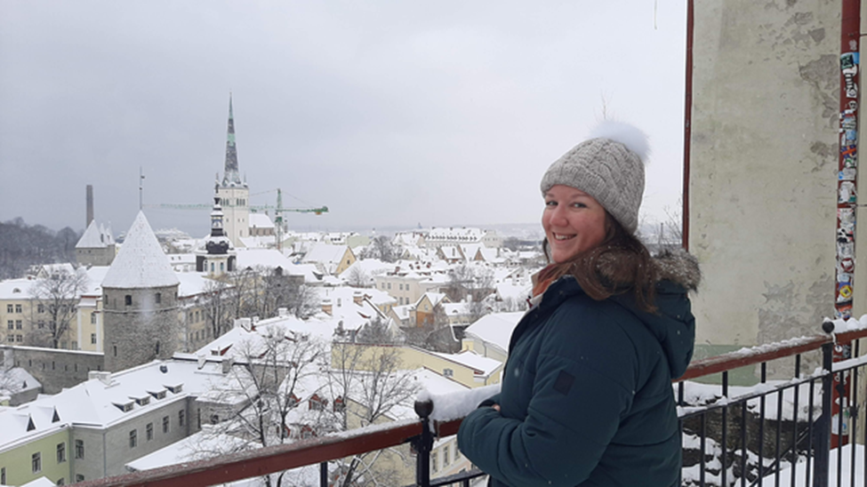 Rita admiring Tallinn's snow-covered rooftops.